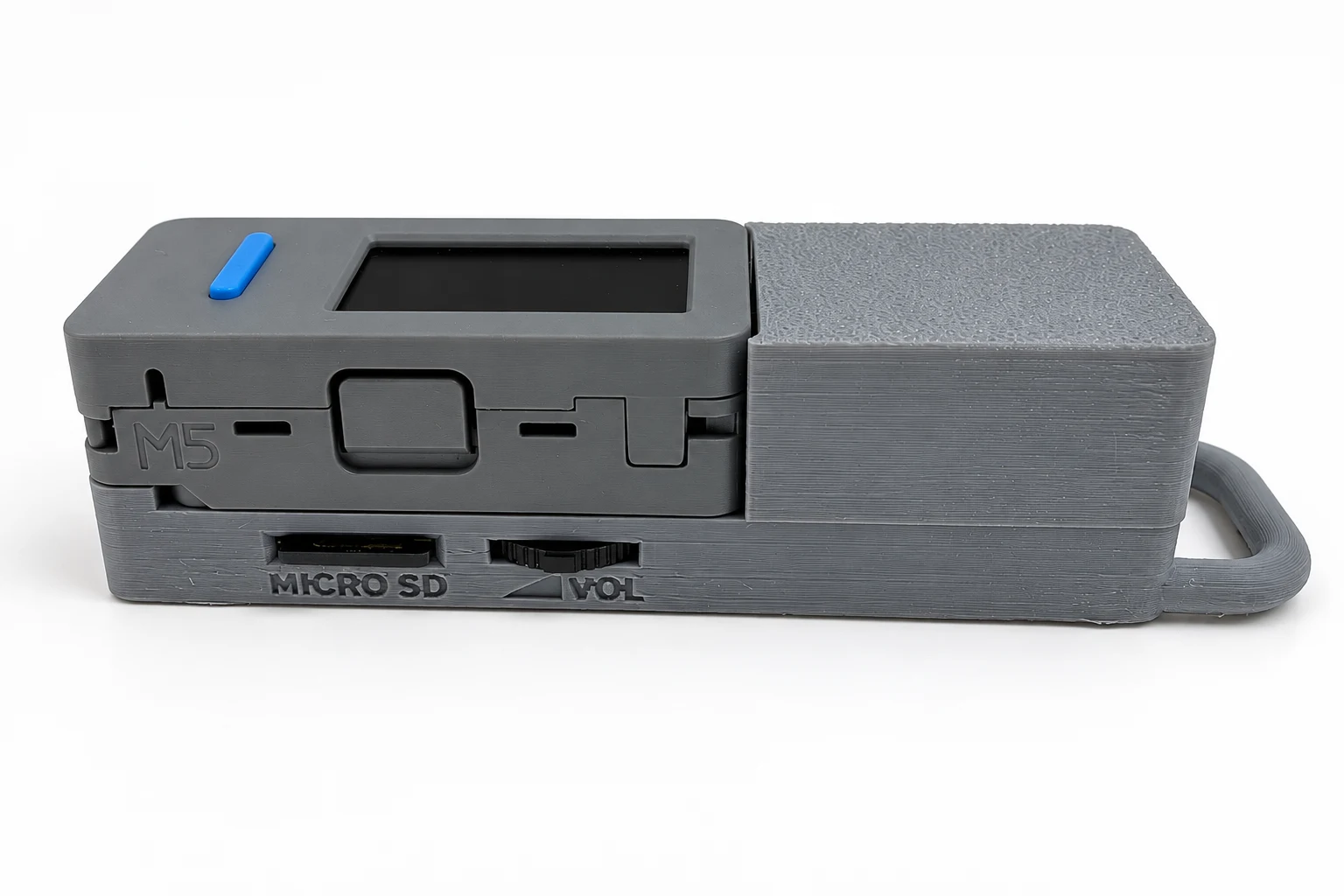 音量コントロール側。M5StickS3中央の大きいボタンがKEY2。下側にmicroSDスロットと音量コントロール。